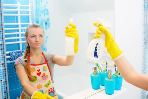 Cleaning staff following a safe work routine in a commercial setting