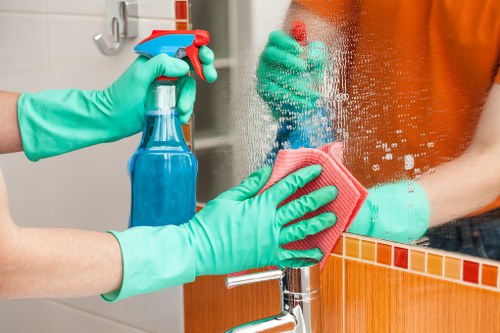 A local cleaning professional working in an Enfield apartment building