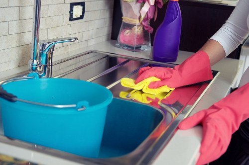 Protective gloves and cleaning products arranged safely for use