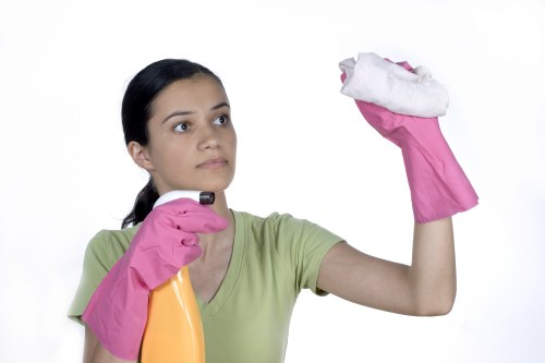 Local sofa cleaner treating stains on a corner sofa in Enfield